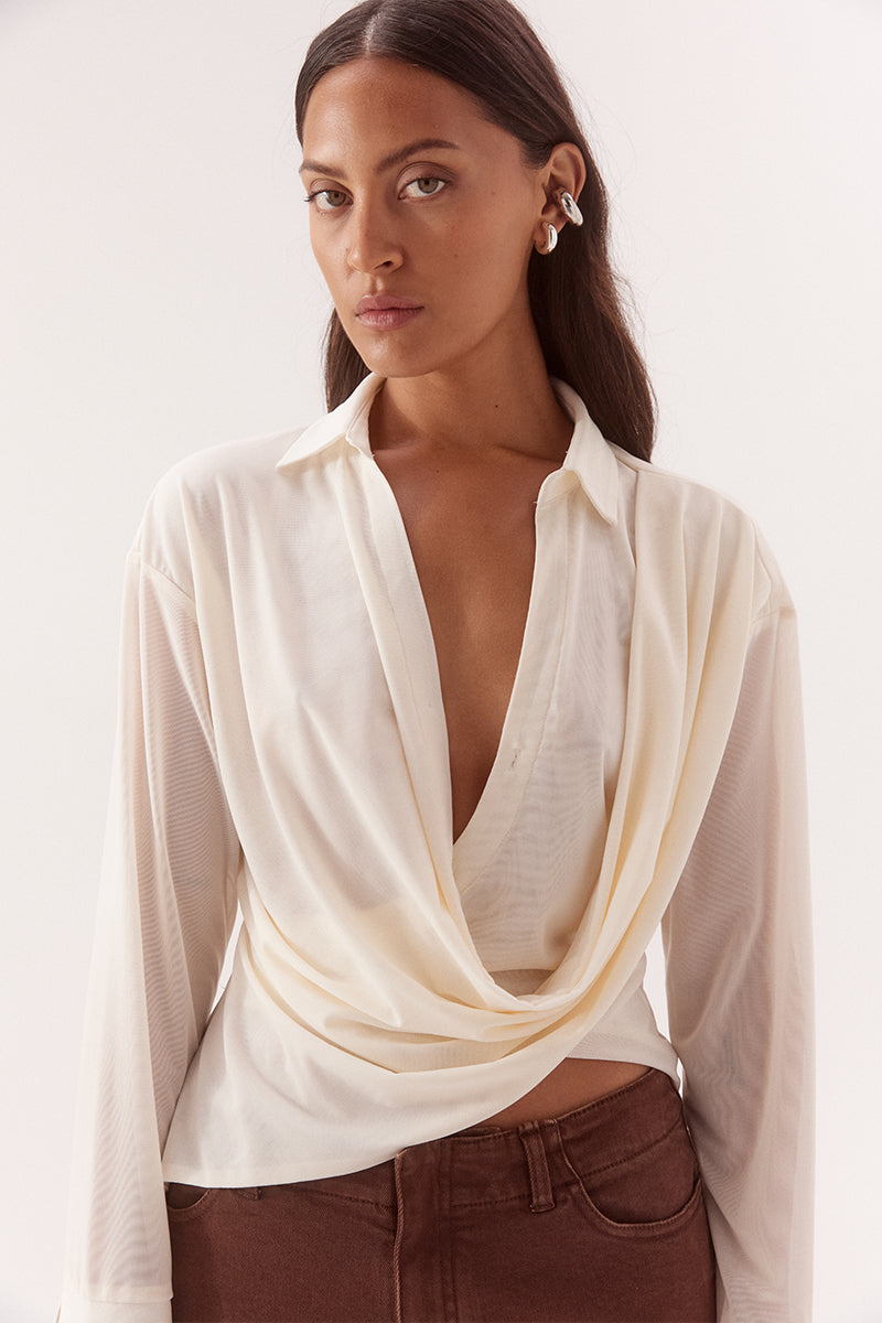 Women's stretch mesh drape front shirt with cowl wrap neckline, dropped shoulders, two-piece collar and wide split cuffs.