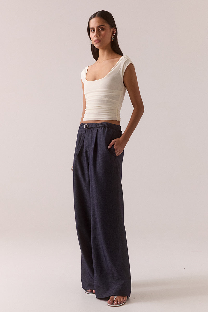 Sleeveless stretch mesh top with wide scoop neckline and fitted silhouette