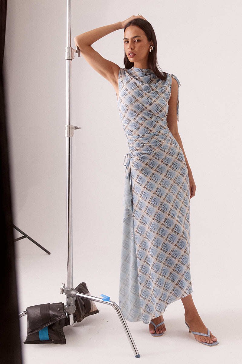 Women’s asymmetric printed stretch mesh midi dress with high neck, drawstring shoulder and waist details, waterfall panel, side split, and lined fit.