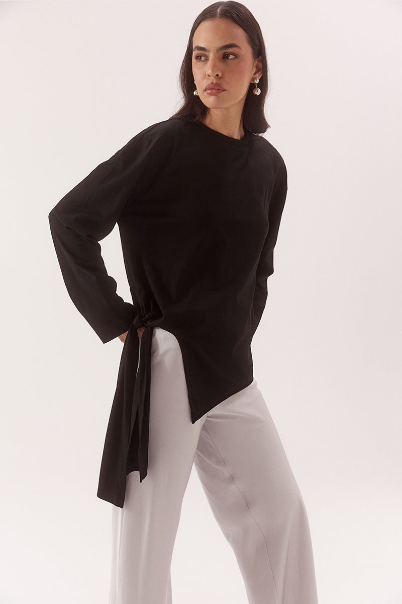 Women's oversized long sleeve cotton tee with dropped shoulders, crew neck, tie-side detail, and relaxed fit. Model wears size 8 and is 178cm tall.