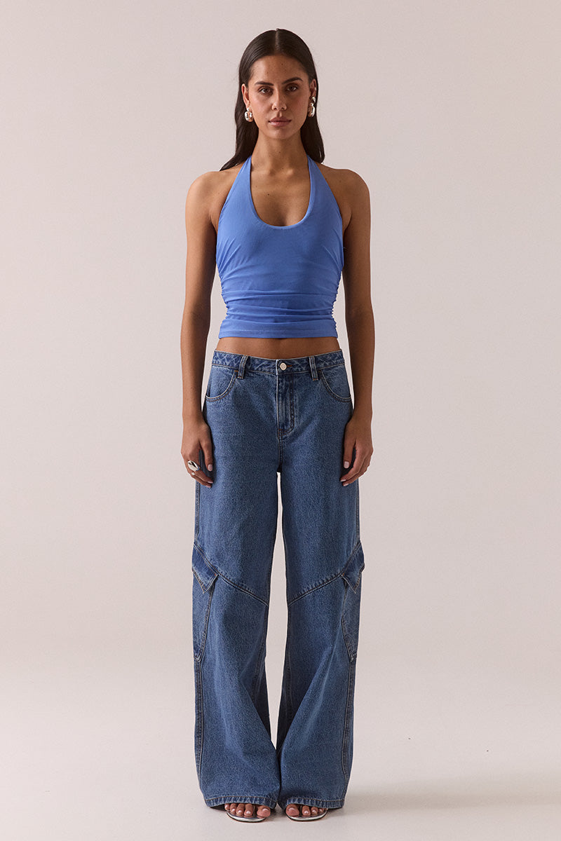 Model wearing stretch mesh two-piece maxi dress with halter neck top, long sleeve bolero, scoop neckline, built-in bralette support, side ruching, and fully lined non-sheer body-contouring fit.