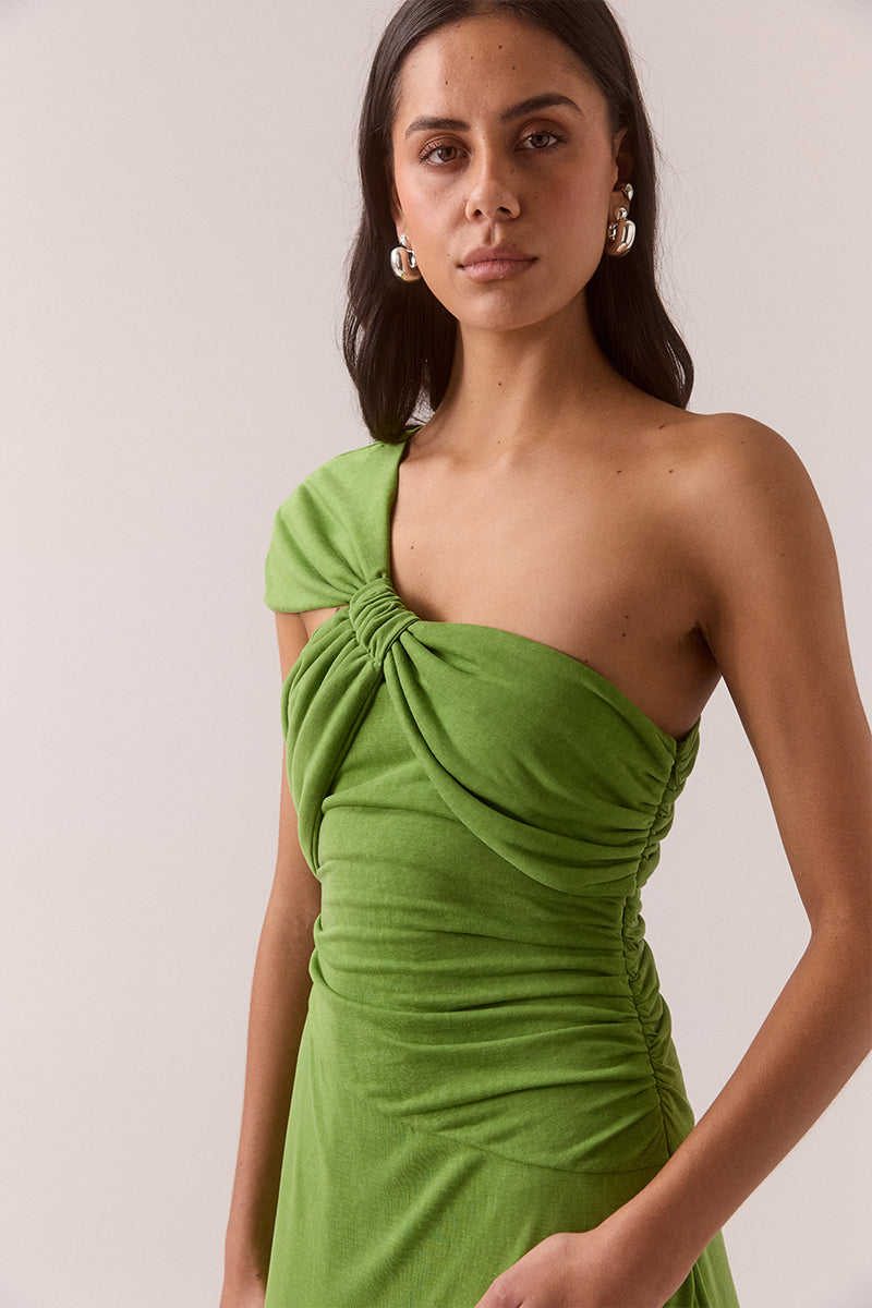 Asymmetric neckline stretch modal blend maxi dress with fitted dropped waist, gathered waist and shoulder details, internal bralette and invisible side zipper, worn by model in size 8.