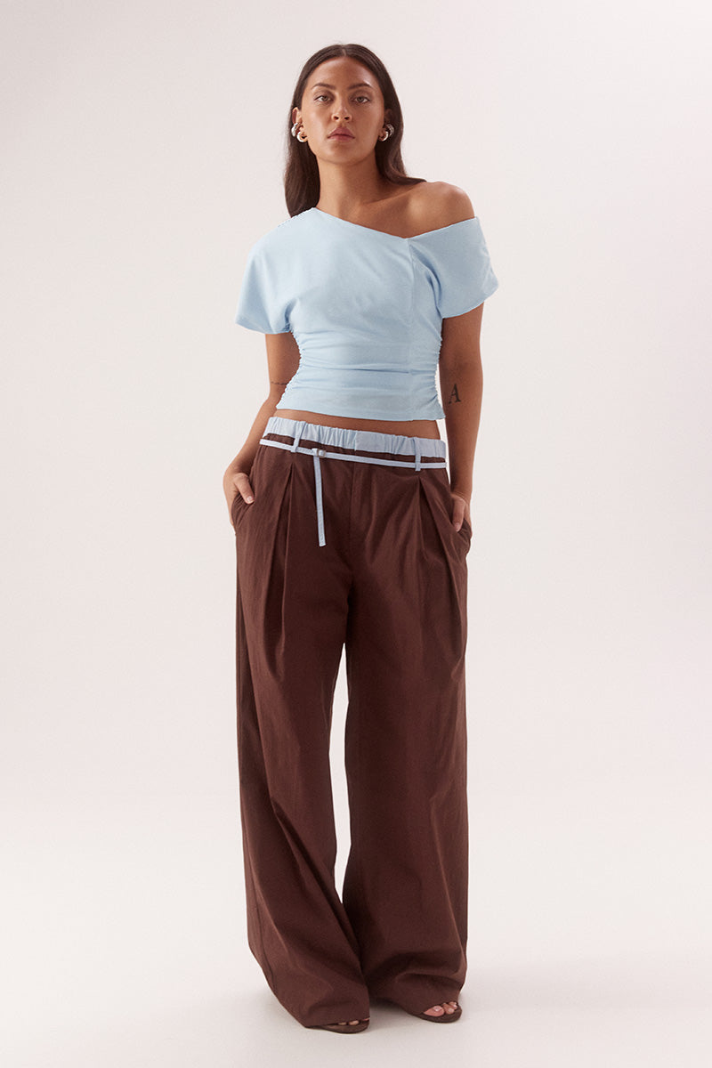 Textured mesh off shoulder top with asymmetric neckline, gathered waist, short sleeves and versatile shoulder styling