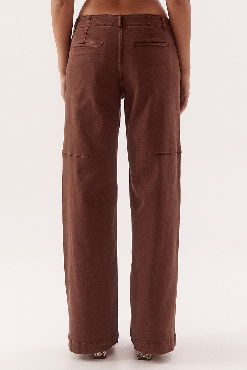 Women's cotton blend mid-rise straight leg jeans with front curved pockets, back welt pockets, fly front and knee dart detailing.