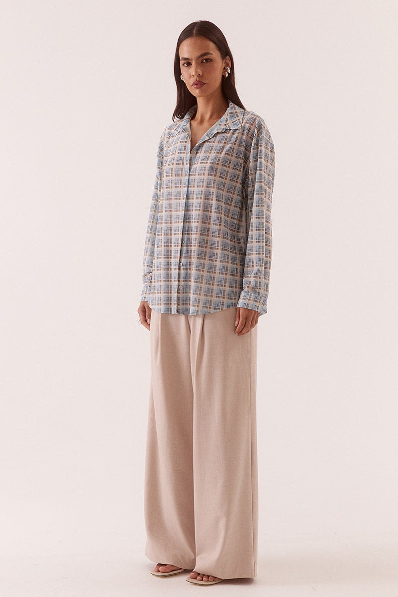 Women’s oversized long sleeve printed stretch mesh shirt with dropped shoulders, button front closure, shaped hem, and two-piece collar detail.