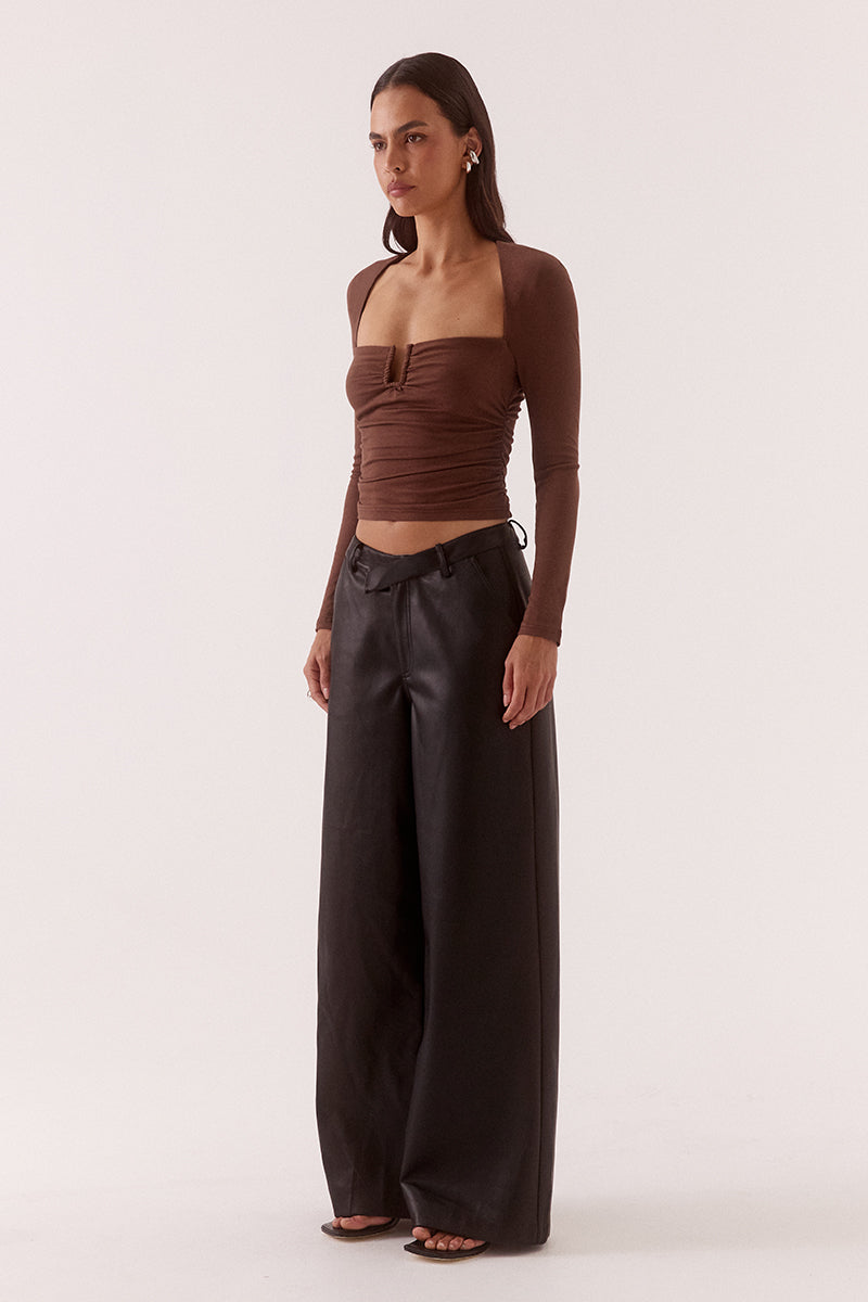 Women’s fitted long sleeve top in rayon blend with front bust cut-out, built-in wire support, gathered bust and waist, and elastic armholes