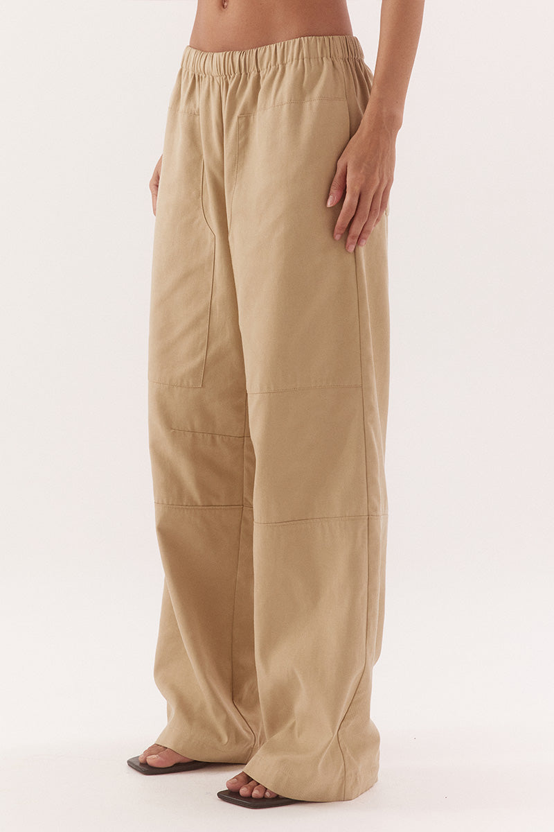 Women's cotton Lyocell blend mid-rise relaxed straight leg pants with oversized side patch pockets, elastic waist and dart detailing.