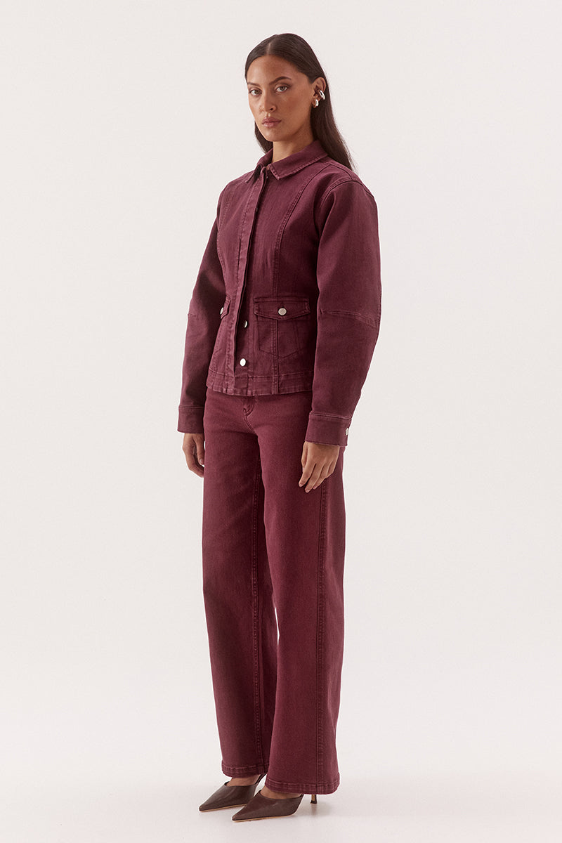 Women's fitted cotton blend denim jacket with a two-piece collar, concealed front button placket, princess seams, and flap pockets.