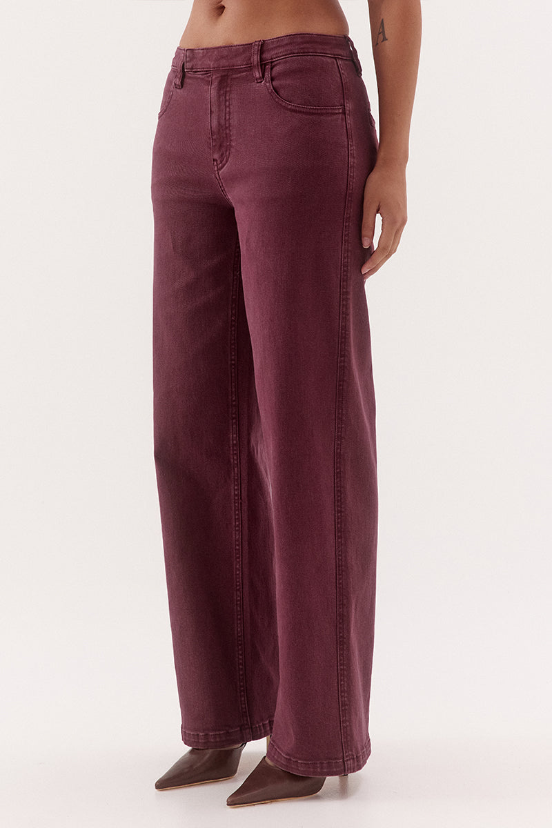 Women's mid-rise straight leg jeans in cotton blend denim with functional front and back pockets, fly-front closure, and tailored hem darts.