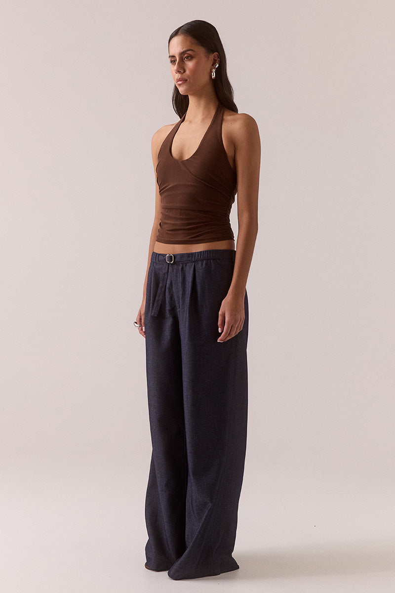 Model wearing stretch mesh two-piece maxi dress with halter neck top, long sleeve bolero, scoop neckline, built-in bralette support, side ruching, and fully lined non-sheer body-contouring fit.