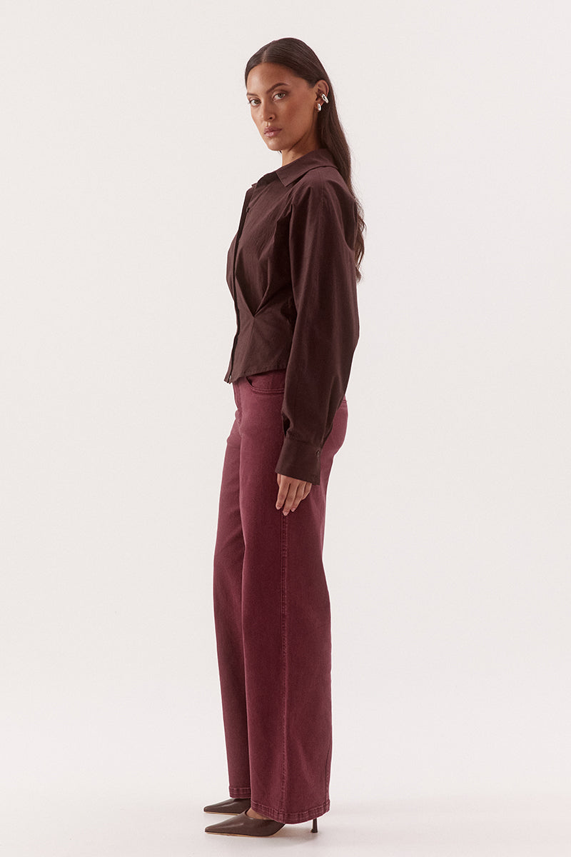 Women's cotton blend long sleeve shirt with a cinched waist, barrel sleeves, concealed button front, two-piece collar, and shaping seam details.