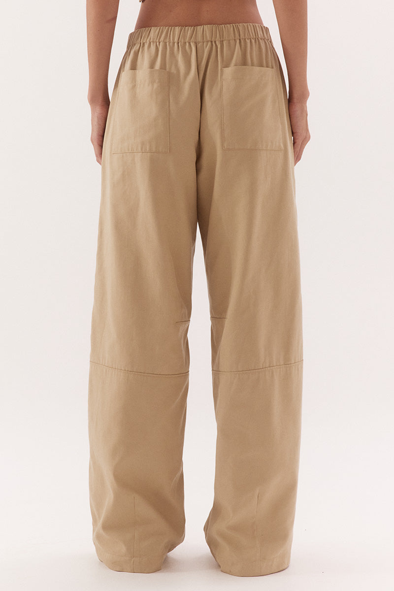Women's cotton Lyocell blend mid-rise relaxed straight leg pants with oversized side patch pockets, elastic waist and dart detailing.