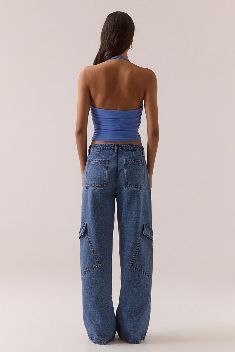 Model wearing stretch mesh two-piece maxi dress with halter neck top, long sleeve bolero, scoop neckline, built-in bralette support, side ruching, and fully lined non-sheer body-contouring fit.