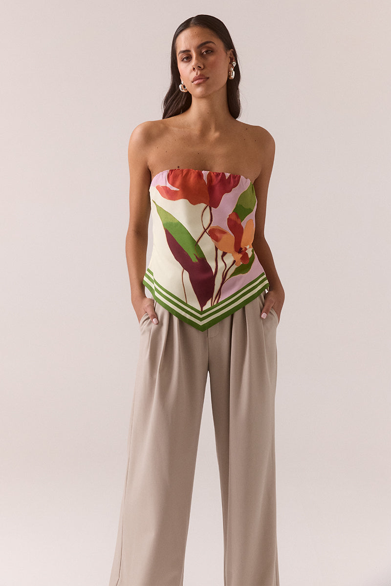 Strapless crepe top with exclusive placement print, V-shaped hemline, elasticated top edge, functional back ties and invisible side zipper, worn by model in size 8.