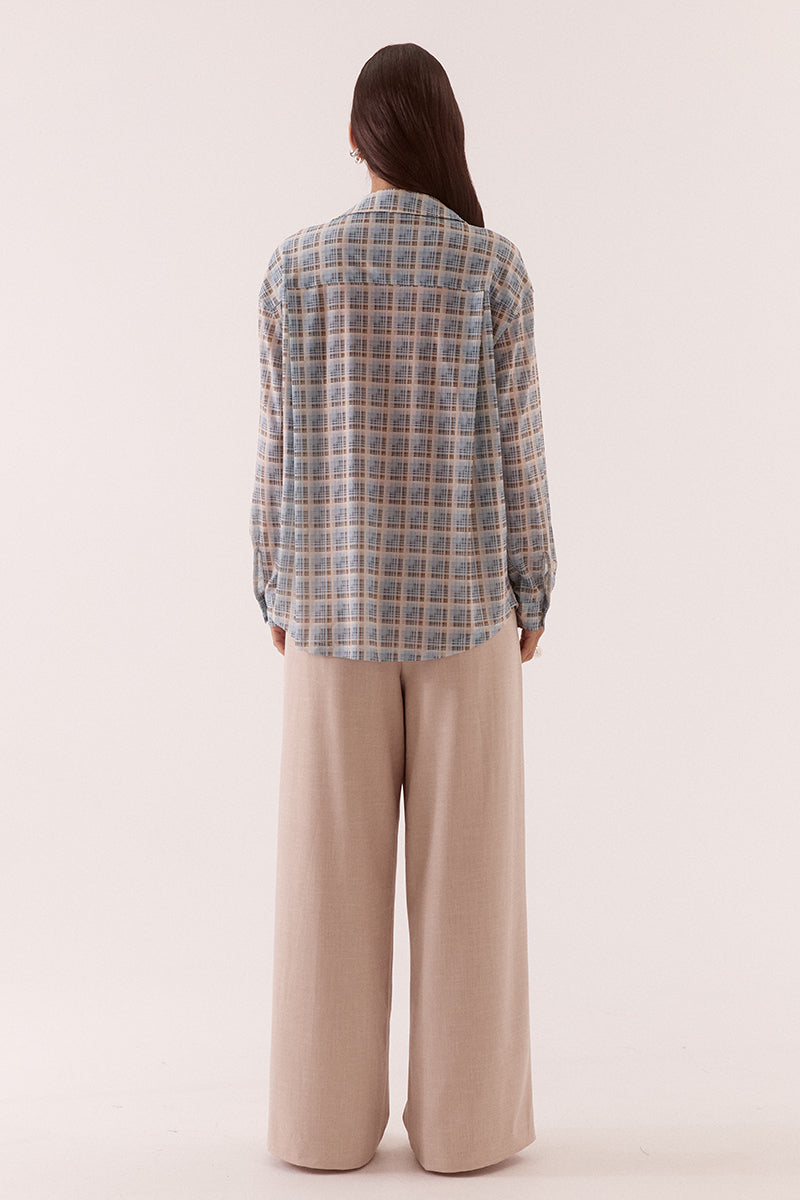 Women’s oversized long sleeve printed stretch mesh shirt with dropped shoulders, button front closure, shaped hem, and two-piece collar detail.
