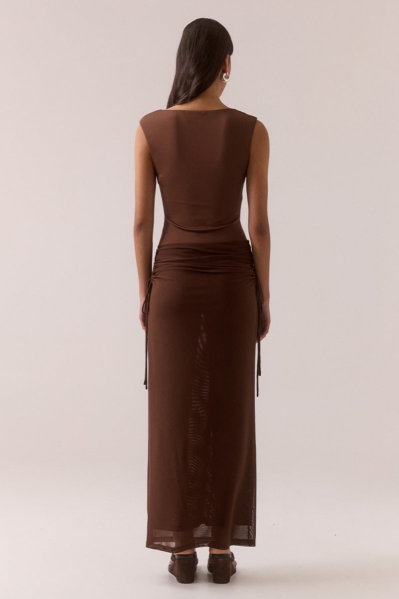 Model wearing stretch mesh two-piece maxi dress with halter neck top, long sleeve bolero, scoop neckline, built-in bralette support, side ruching, and fully lined non-sheer body-contouring fit.