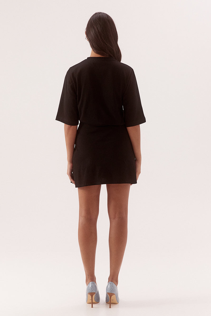 - Cotton fabrication
- Relaxed fit T- shirt mini dress
- Cinched waist
- Crew neck
- Elbow length sleeve
- Skirt overlayer has pleats pulled to one side and held by a silver metal rod
- Asymmetric hem
- Invisible zipper at side
- Length: 86cm