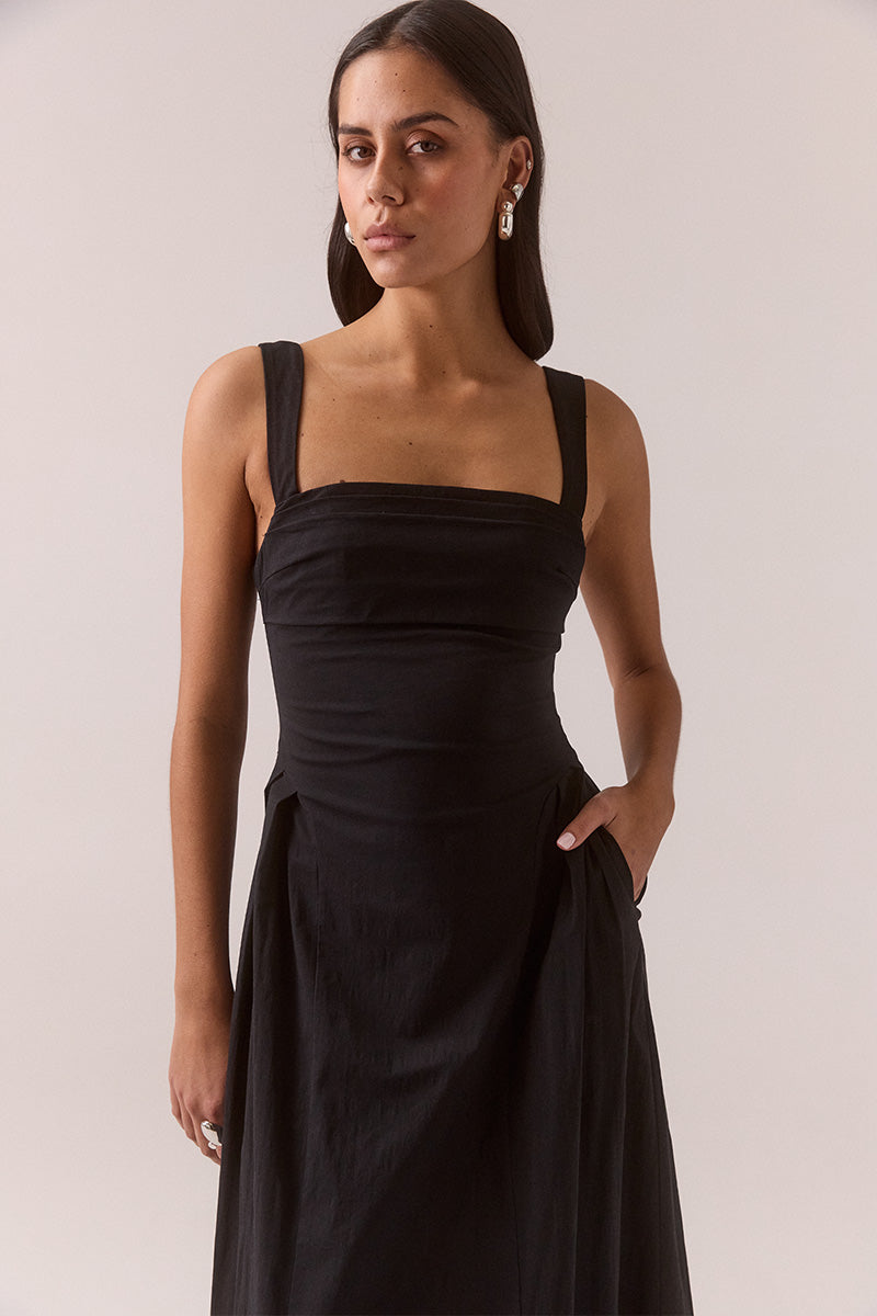 Women’s fit and flare midi dress in stretchy cotton blend with balconette neckline, layered tuck details, curved skirt panels, adjustable wide straps, and hidden side pockets.