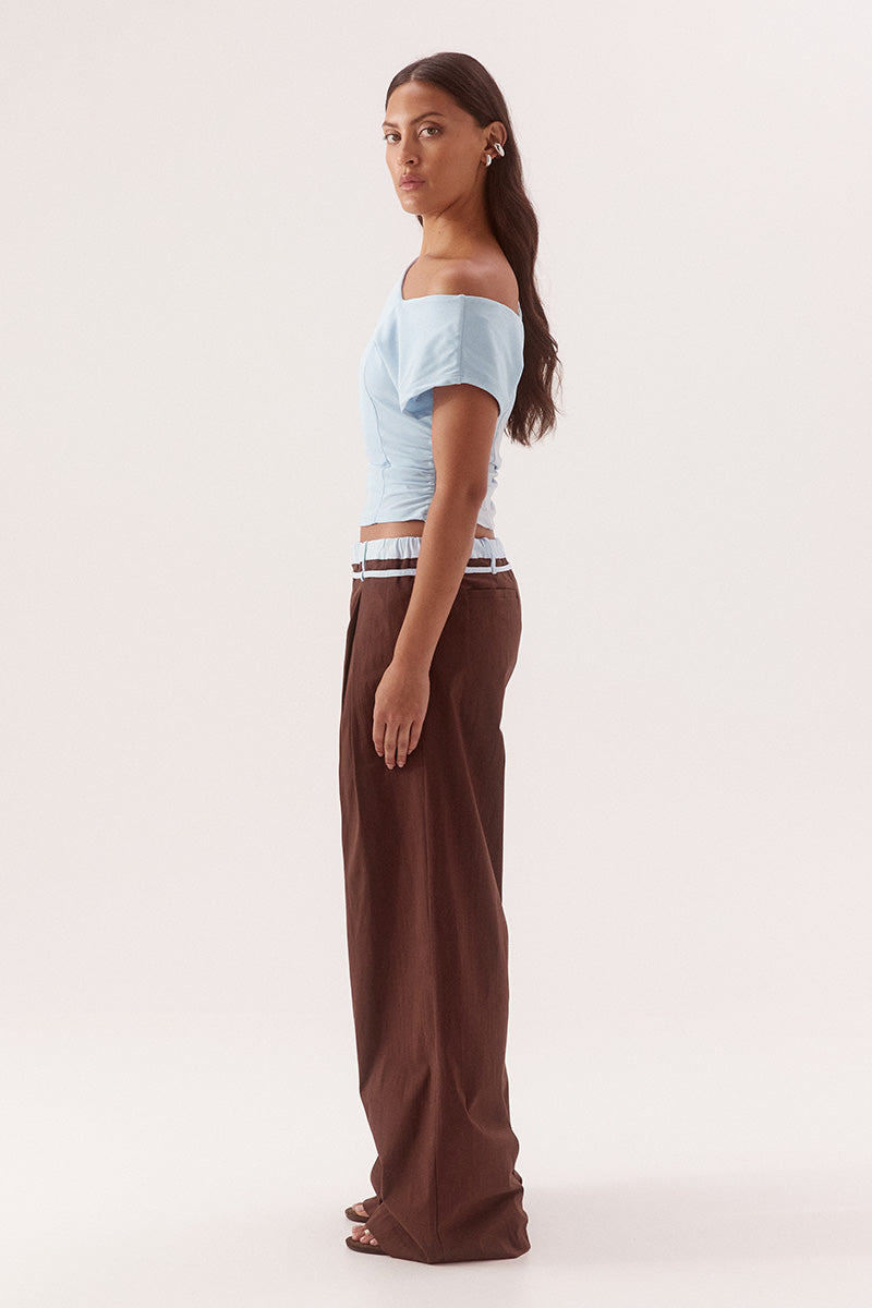Textured mesh off shoulder top with asymmetric neckline, gathered waist, short sleeves and versatile shoulder styling
