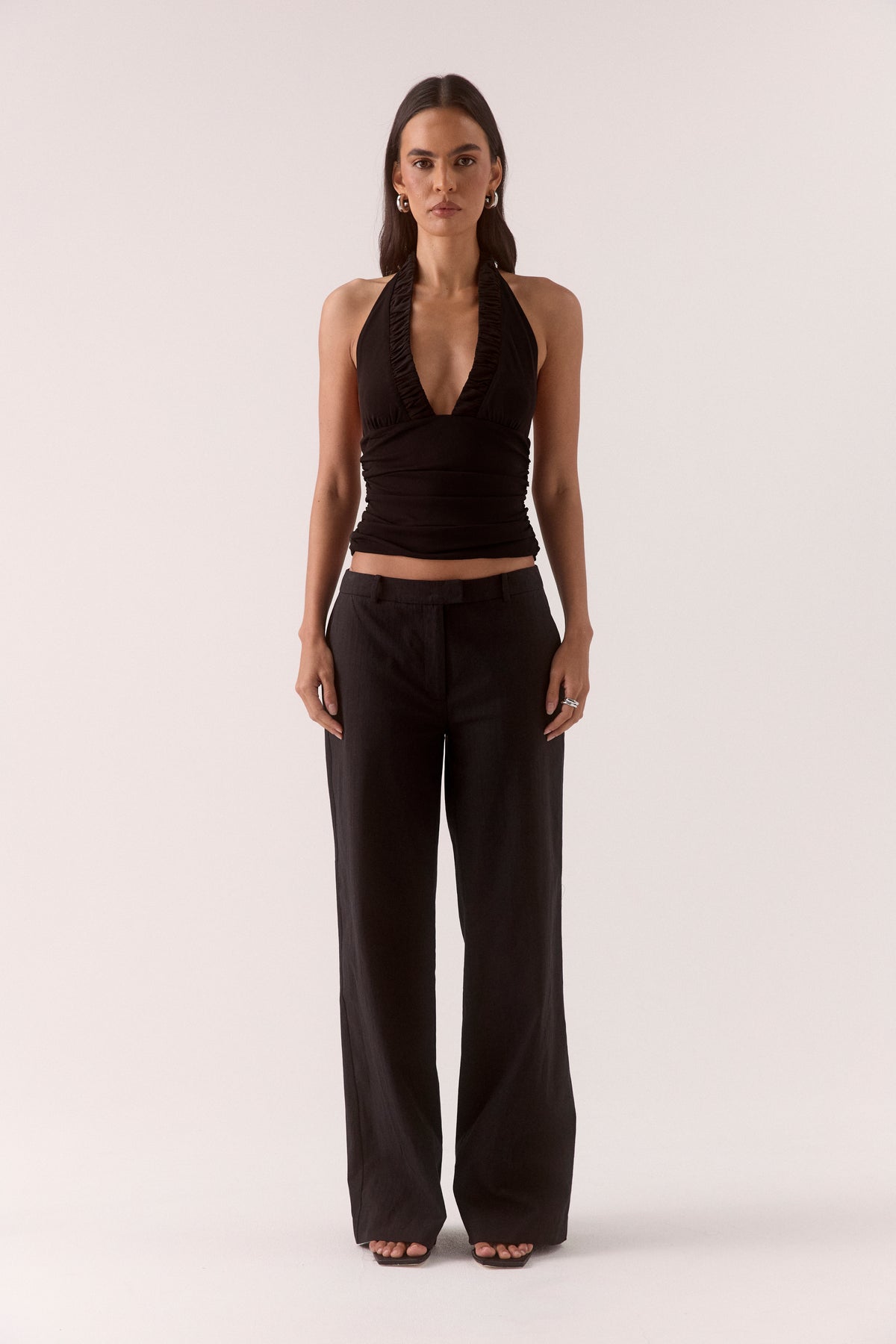 Women’s textured stretch mesh empire halter neck top with gathered side detailing, back neck tie, elasticated back and flattering fitted silhouette.