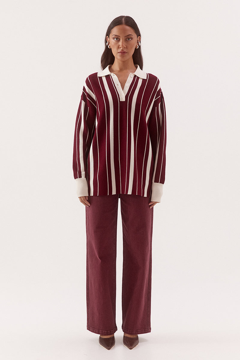 Women’s oversized knit sweater with multicolour stripe design, collar with button placket, dropped shoulders and ribbed cuffs, hem and trims