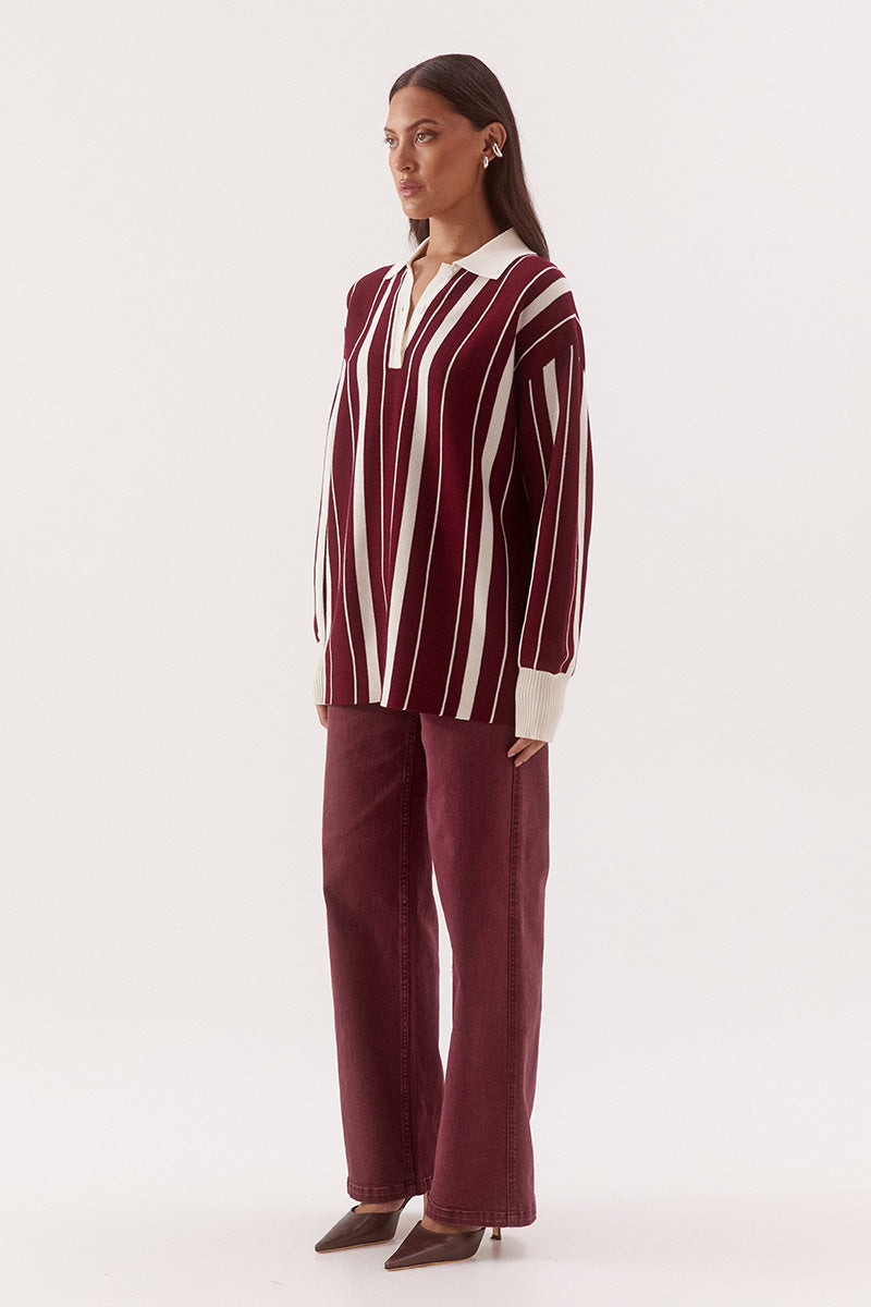 Women’s oversized knit sweater with multicolour stripe design, collar with button placket, dropped shoulders and ribbed cuffs, hem and trims