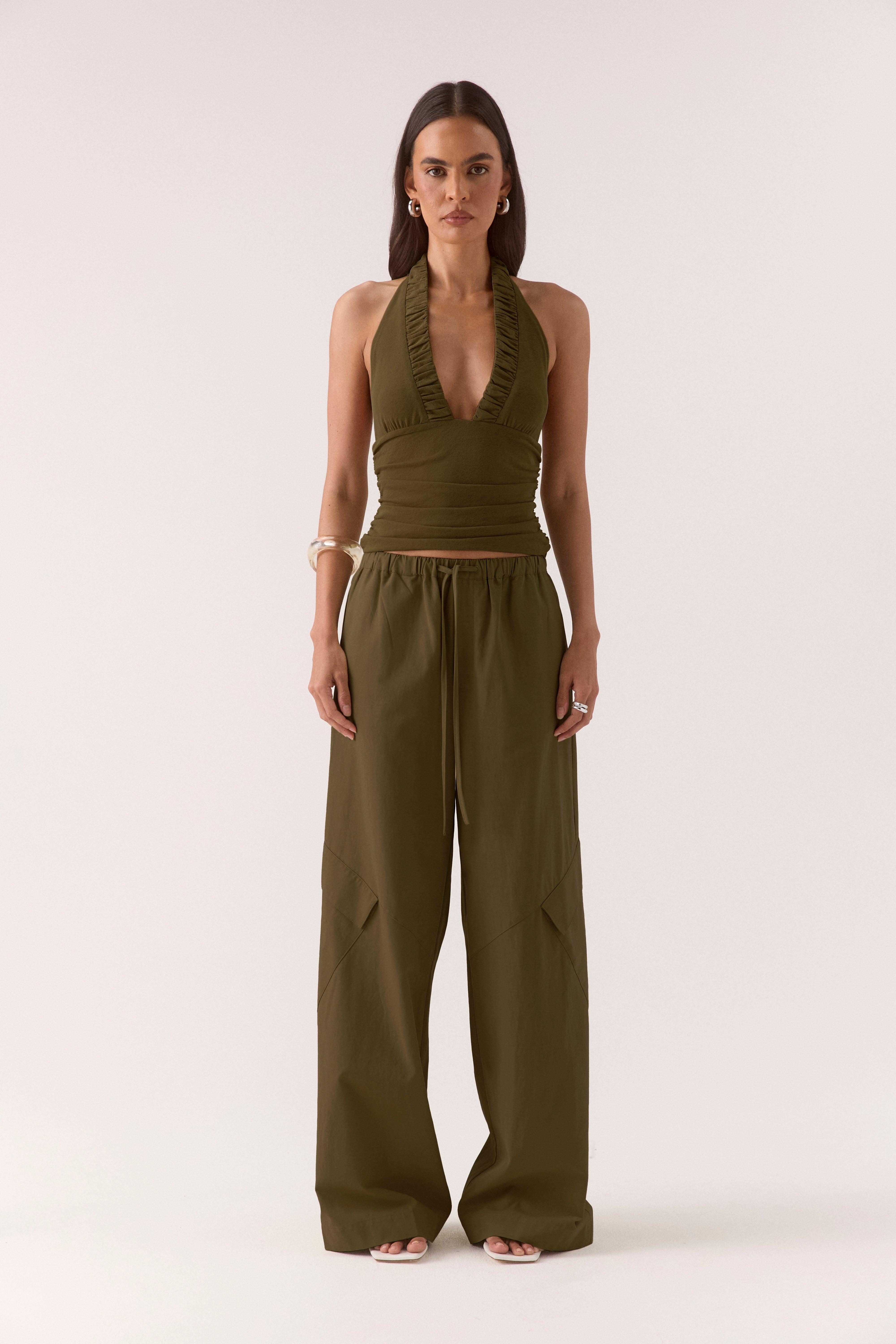Women’s textured stretch mesh empire halter neck top with gathered side detailing, back neck tie, elasticated back and flattering fitted silhouette.
