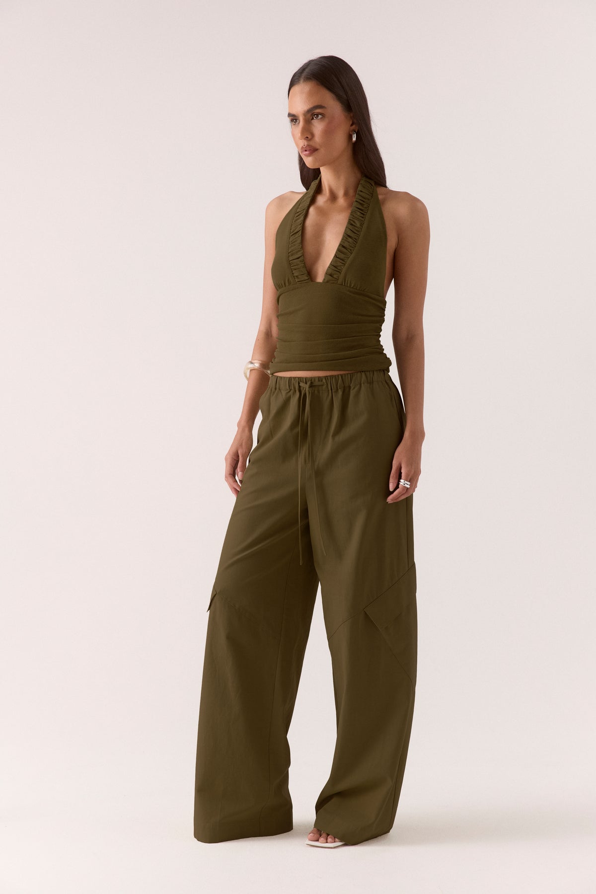 Women’s textured stretch mesh empire halter neck top with gathered side detailing, back neck tie, elasticated back and flattering fitted silhouette.