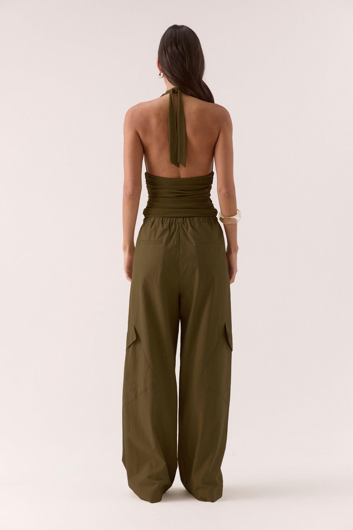 Women’s textured stretch mesh empire halter neck top with gathered side detailing, back neck tie, elasticated back and flattering fitted silhouette.